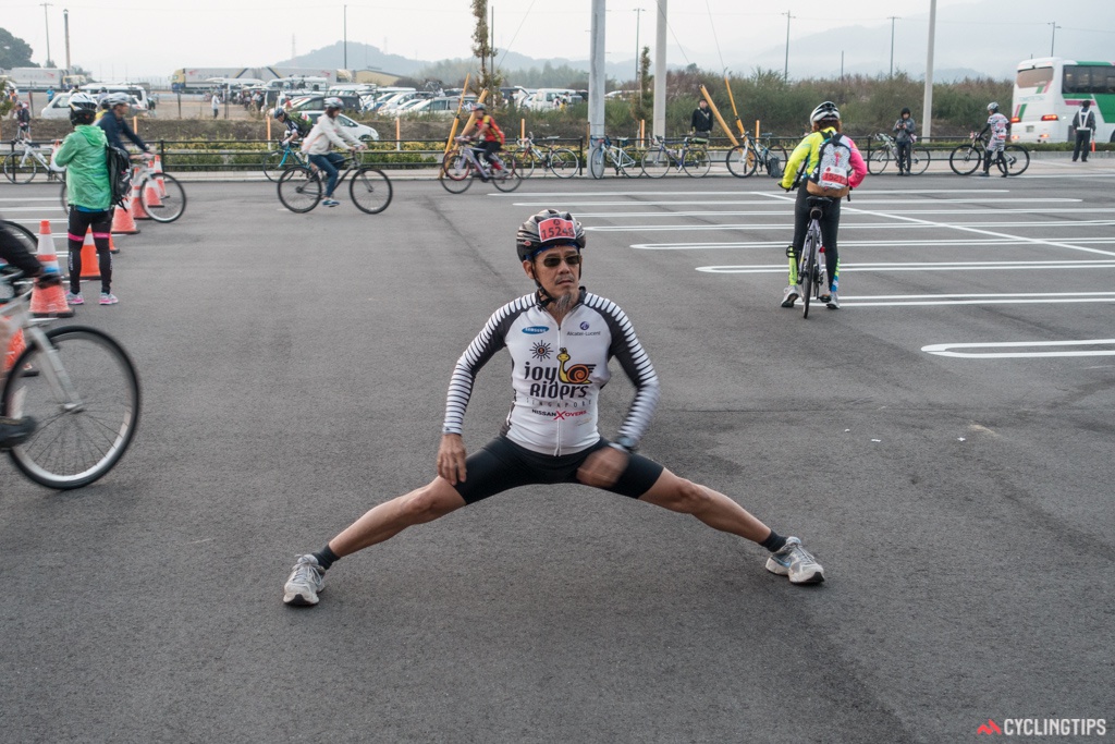 Old mate having a bit of a pre-ride stretch at Cycling Shimanami.