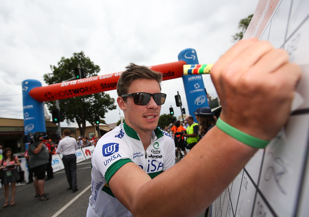 Newly signed Orica-GreenEdge recruit Alex Edmondson signs on for the start of stage 1. He's riding for the UniSA-Australia national team.