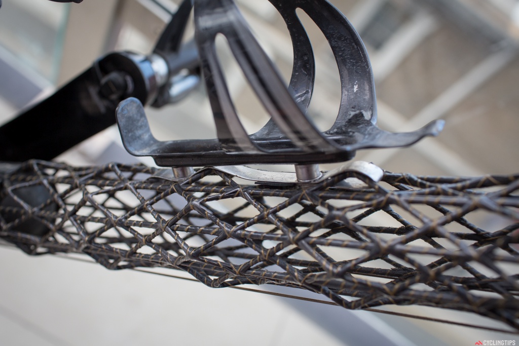 The bottle cages are attached to the frame by these braces shown here, but since the original ones broke these don't look nearly as nice as the original solution