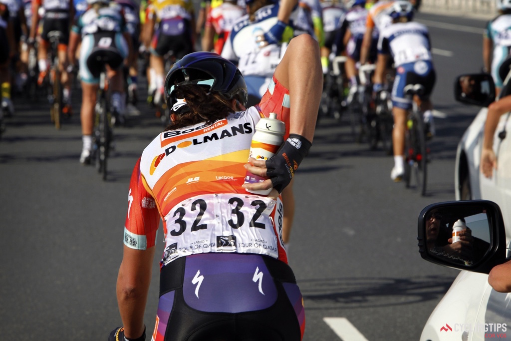 Chantal Blaak (Boels-Dolmans) slips a bottle into her jersey pocket as she made her way back to the bunch. Hydration is key in the Qatari desert. For the riders who spent the European winter racing in Australian summer, Qatar represents the last of warm weather racing. For the Europeans and North Americans, Qatar is a welcome reprieve from harsh weather training.