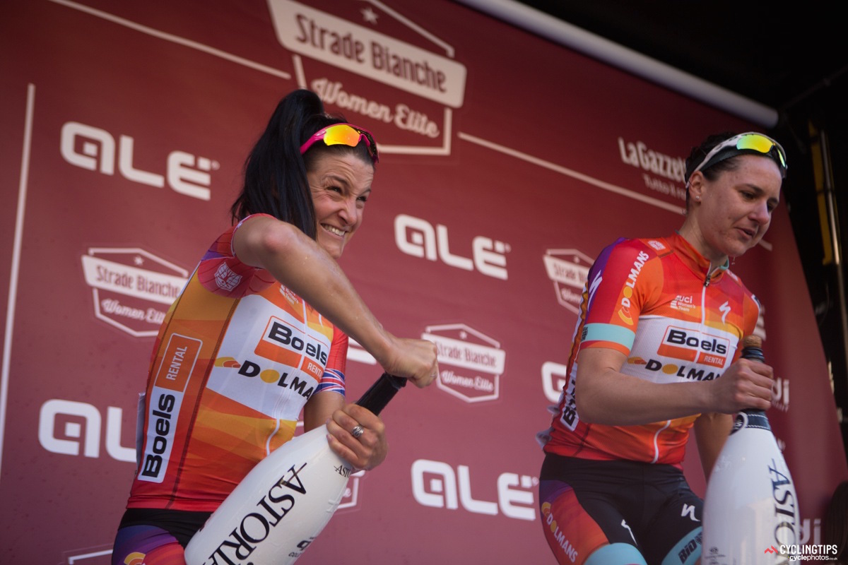 Much to the delight of the crowd gathered around the podium, Lizzie Armitstead and Megan Guarnier hilariously struggled to open their bottles of champagne.