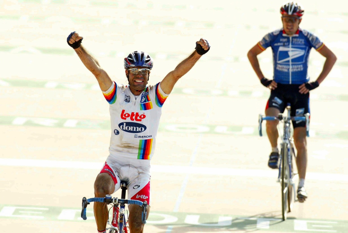 Peter van Petegem celebrates after winning the 2003 Paris-Roubaix ahead of Dario Pieri. Van Petegem now sells insurance in a small town near Gent, close to the Koppenberg.