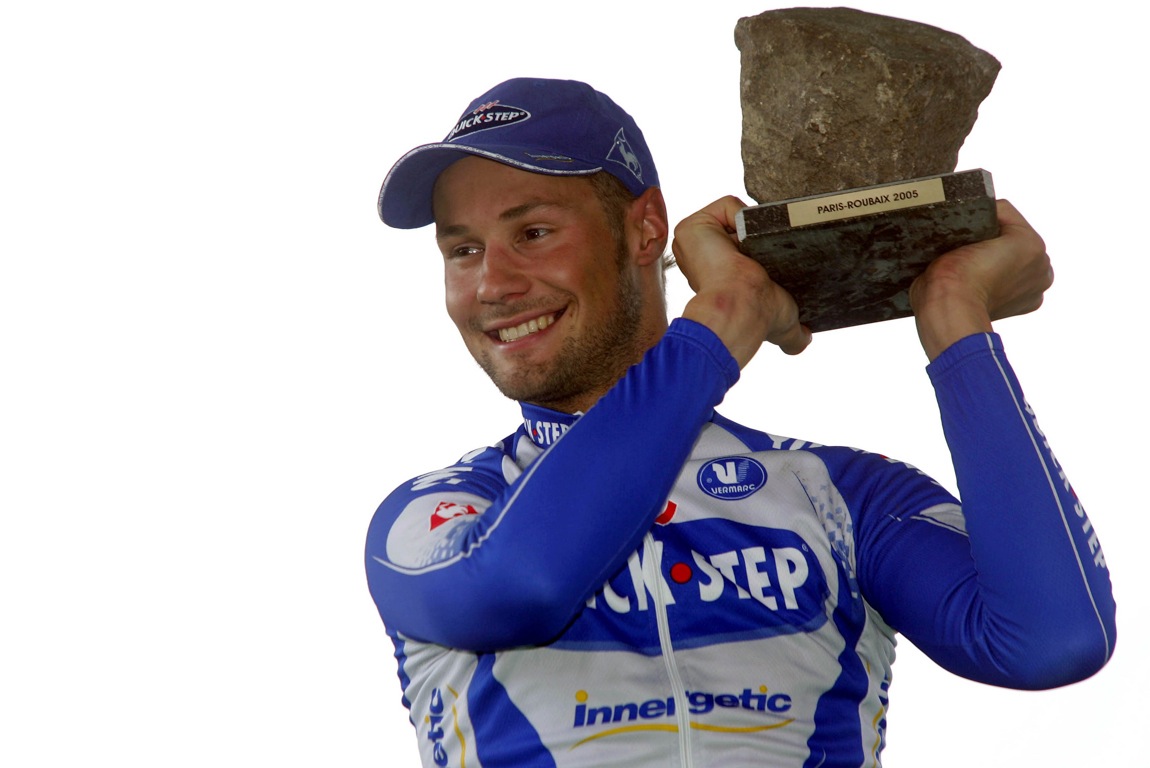 Tom Boonen holds aloft the first of his four cobblestone trophies from Paris-Roubaix.