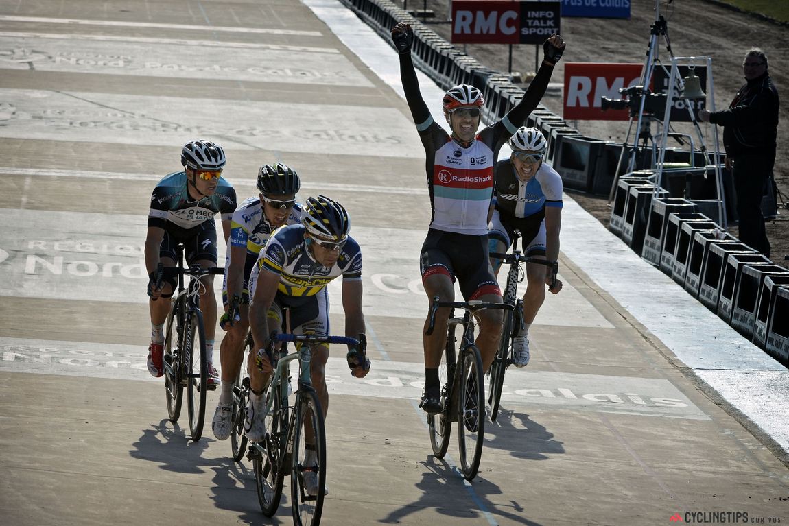 Fabian Cancellara won his third Paris-Roubaix in 2013 from a two-up sprint against Sep Vanmarcke (the three riders on the left still have a lap to go). Cancellara and Vanmarcke had ridden into the Roubaix Velodrome together and while Cancellara was leading in the early part of the lap, Vanmarcke was forced to the front by some clever riding by Cancellara. Vanmarcke started his sprint first but Cancellara caught on to the Belgian's wheel, then pushed past for an hard-fought win.