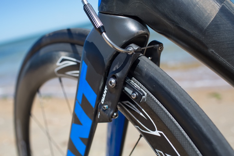 The TRP "mini-V" linear pull brakes hidden behind he front fork.