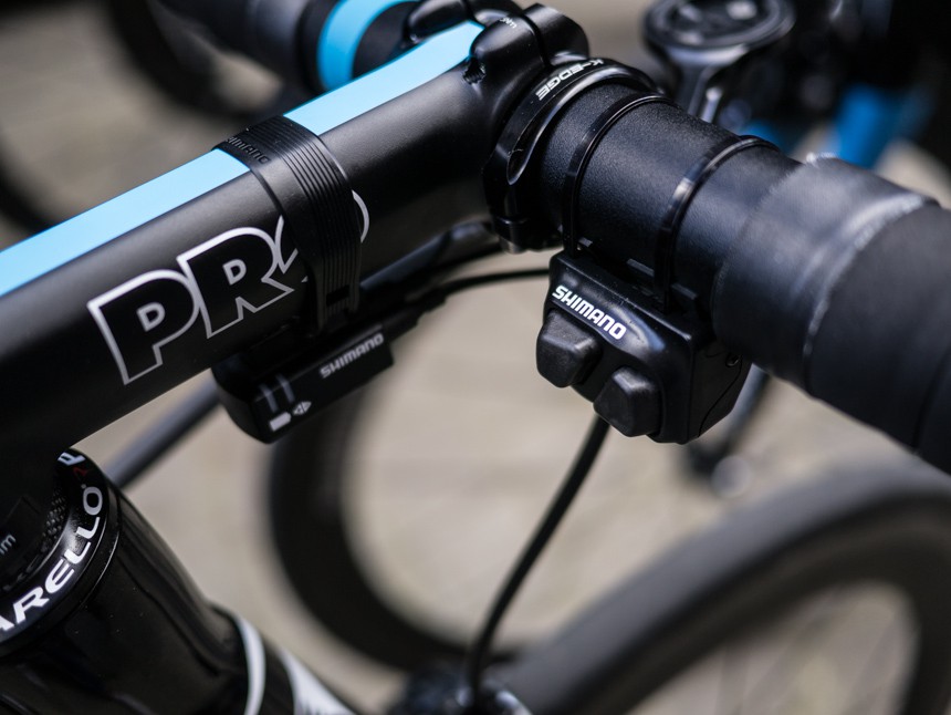  Many of the teams are using Shimano's remote climbing shifters. One button shifts up on the rear derailleur, and the other shifts down. This positioning makes it easier to reach while riding on the cobbles when the rider's hands are positioned on the tops of the handlebars.