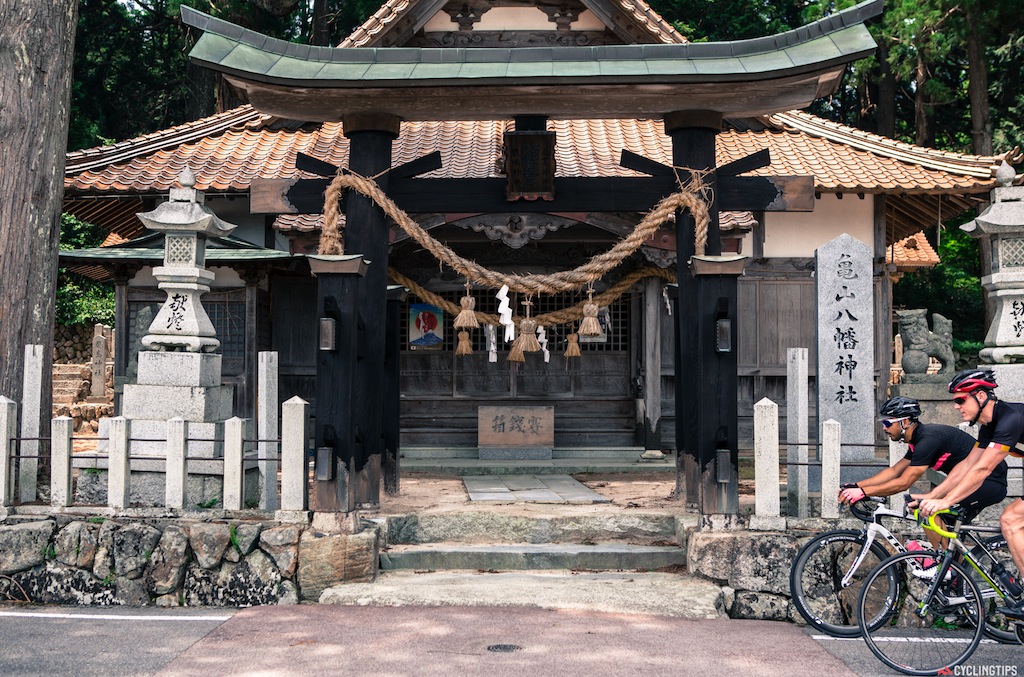 Riding past one of the many shrines in the area